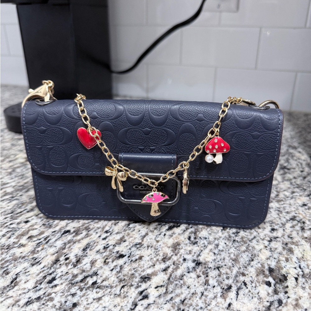 Coach Dark Blue Embossed Clutch with Gold Accents